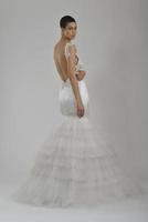 elegant woman in fashionable dress posing in the studio photo