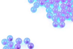 cyan spherical ball capsules with selective focus isolated on white background photo