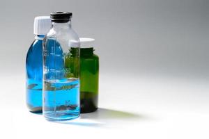 colored medial bottles on gray background with copyspace photo