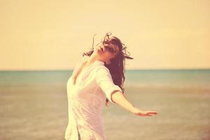 happy young woman on beach photo