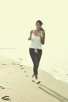 woman running on beach photo