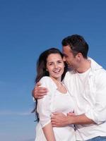 young couple  on beach have fun photo