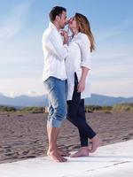 young couple  on beach have fun photo