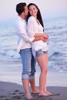 young couple  on beach have fun photo