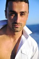 young man at beach photo