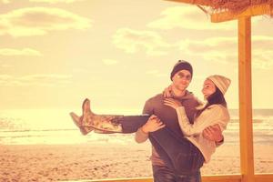 Couple chating and having fun at beach bar photo