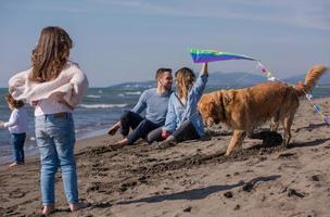 happy young family enjoying vecation during autumn day photo