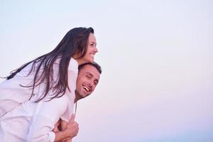 young couple  on beach have fun photo