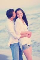 young couple  on beach have fun photo