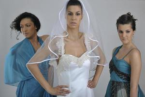 portrait of a three beautiful woman in wedding dress photo