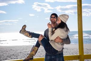 Couple chating and having fun at beach bar photo