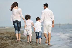 happy young family have fun on beach photo