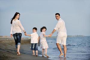 happy young family have fun on beach photo