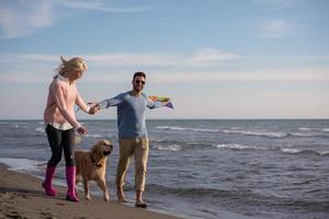 happy couple enjoying time together at beach photo