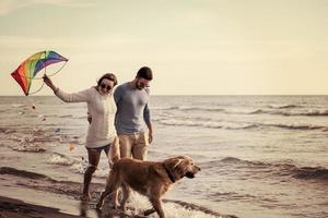 happy couple enjoying time together at beach photo