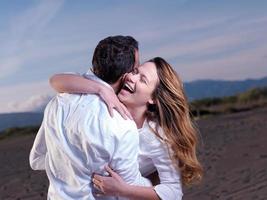 young couple  on beach have fun photo