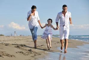 happy young  family have fun on beach photo