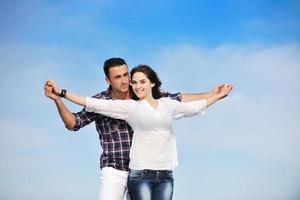 happy young couple have fun on beach photo