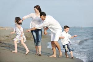 happy young family have fun on beach photo