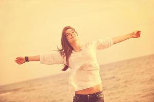 young woman enjoy on beach photo