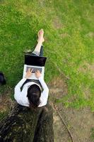 woman with laptop in park photo