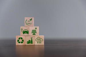 Companies are targeting net zero greenhouse gas emissions. Carbon credit concept.Tradable certificate to drive industry in direction of low emissions in efficiency cost. Wooden cubes with decrease CO2 photo