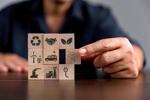 Companies are targeting net zero greenhouse gas emissions. Carbon credit concept.Tradable certificate to drive industry in direction of low emissions in efficiency cost. Wooden cubes with decrease CO2 photo