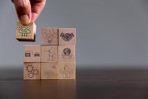 Companies are targeting net zero greenhouse gas emissions. Carbon credit concept.Tradable certificate to drive industry in direction of low emissions in efficiency cost. Wooden cubes with decrease CO2 photo