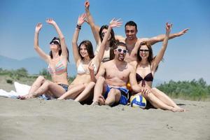 happy child group playing  on beach photo