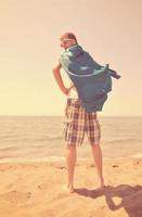 funny superhero standing on beach photo