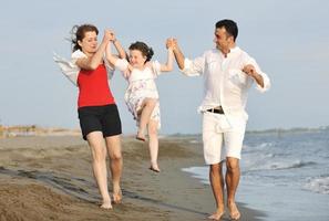 happy young family have fun on beach photo