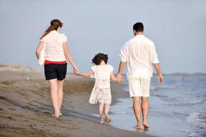 happy young family have fun on beach photo