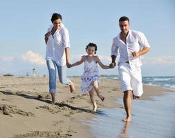 happy young  family have fun on beach photo