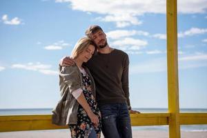 Couple chating and having fun at beach bar photo