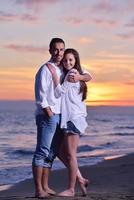 young couple  on beach have fun photo