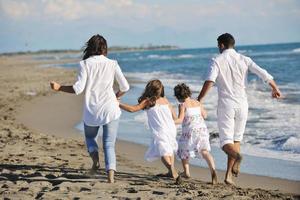 happy young  family have fun on beach photo