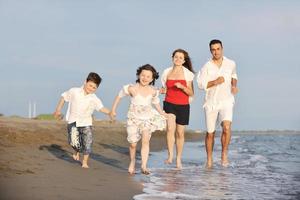 happy young family have fun on beach photo