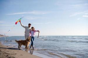 happy couple enjoying time together at beach photo