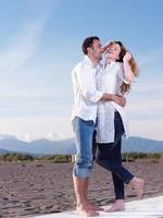 young couple  on beach have fun photo