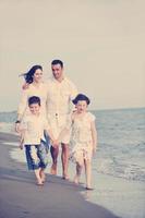 happy young family have fun on beach photo