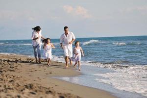 happy young  family have fun on beach photo