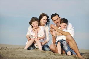 happy young family have fun on beach photo