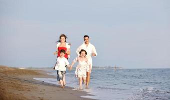 happy young family have fun on beach photo