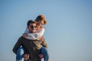 couple having fun at beach during autumn photo