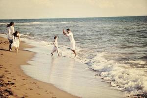 happy young  family have fun on beach photo