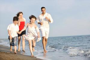 happy young family have fun on beach photo