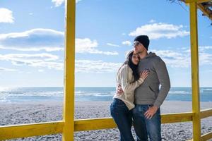 Couple chating and having fun at beach bar photo