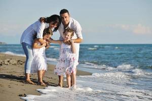 happy young  family have fun on beach photo