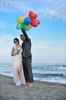 romantic beach wedding at sunset photo