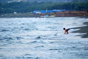 childs having fun on beach at early morning photo